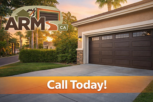 Local technician repairing residential garage door system